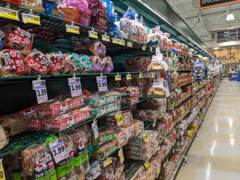 picture of harris teeter bread aisle showing the overwhelming amount of bread options